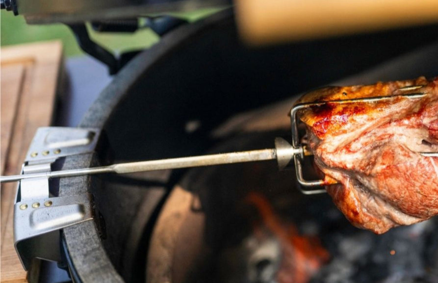 Meat on a rotisserie over an open flame