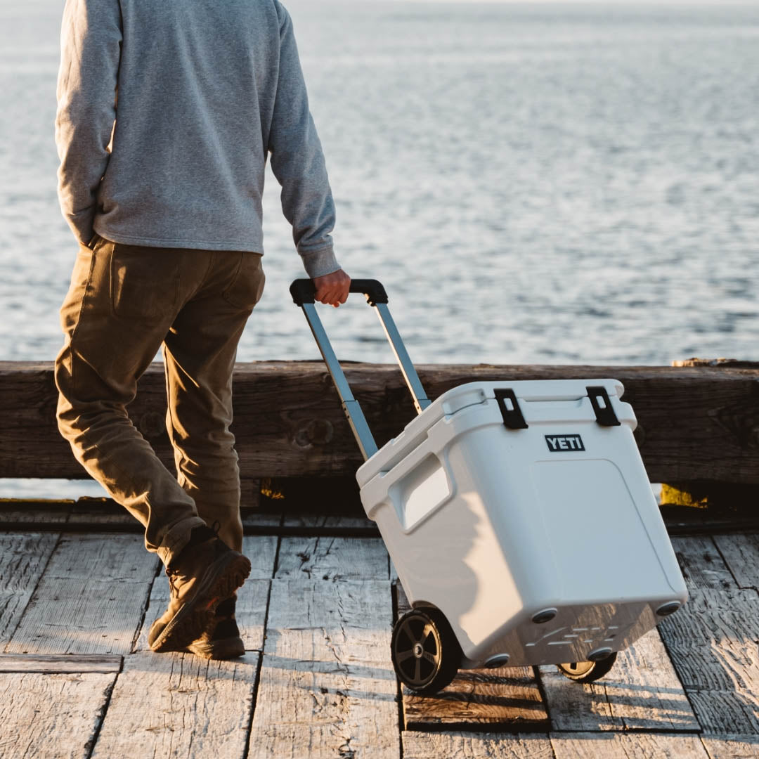 YETI Roadie 48 Wheeled Cool Box in white on the deck