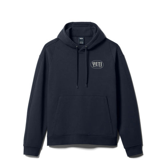 A dark navy blue pullover hoodie with a drawstring hood, kangaroo pocket, and a small oval YETI logo on the left chest, displayed on a clean white background.