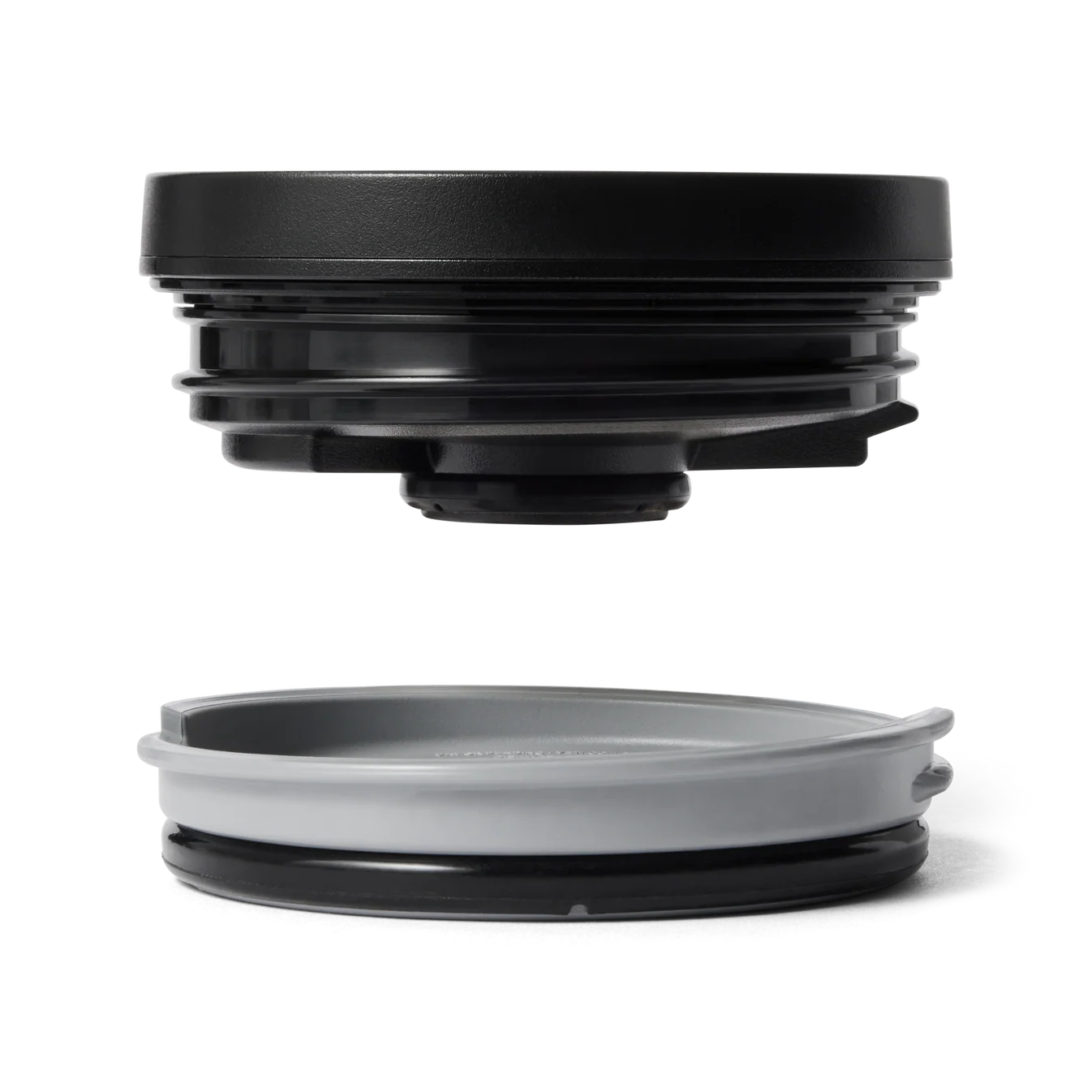 Two black and gray rubber seals on a white background