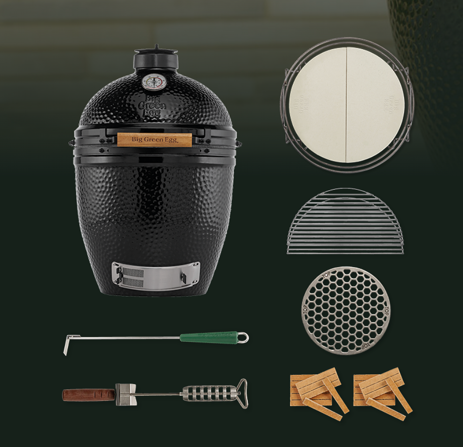 Black Onyx kamado-style grill with a textured exterior, temperature gauge, and silver metal trim, shown alongside included accessories: a round lid insert, two metal grates, a round vent insert, a long-handled tool with a green handle, a smaller hand tool with a brown handle, and two wooden starter bricks on a dark green background.