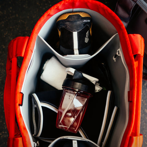 Bag with a YETI protein shaker inside, on a dark background